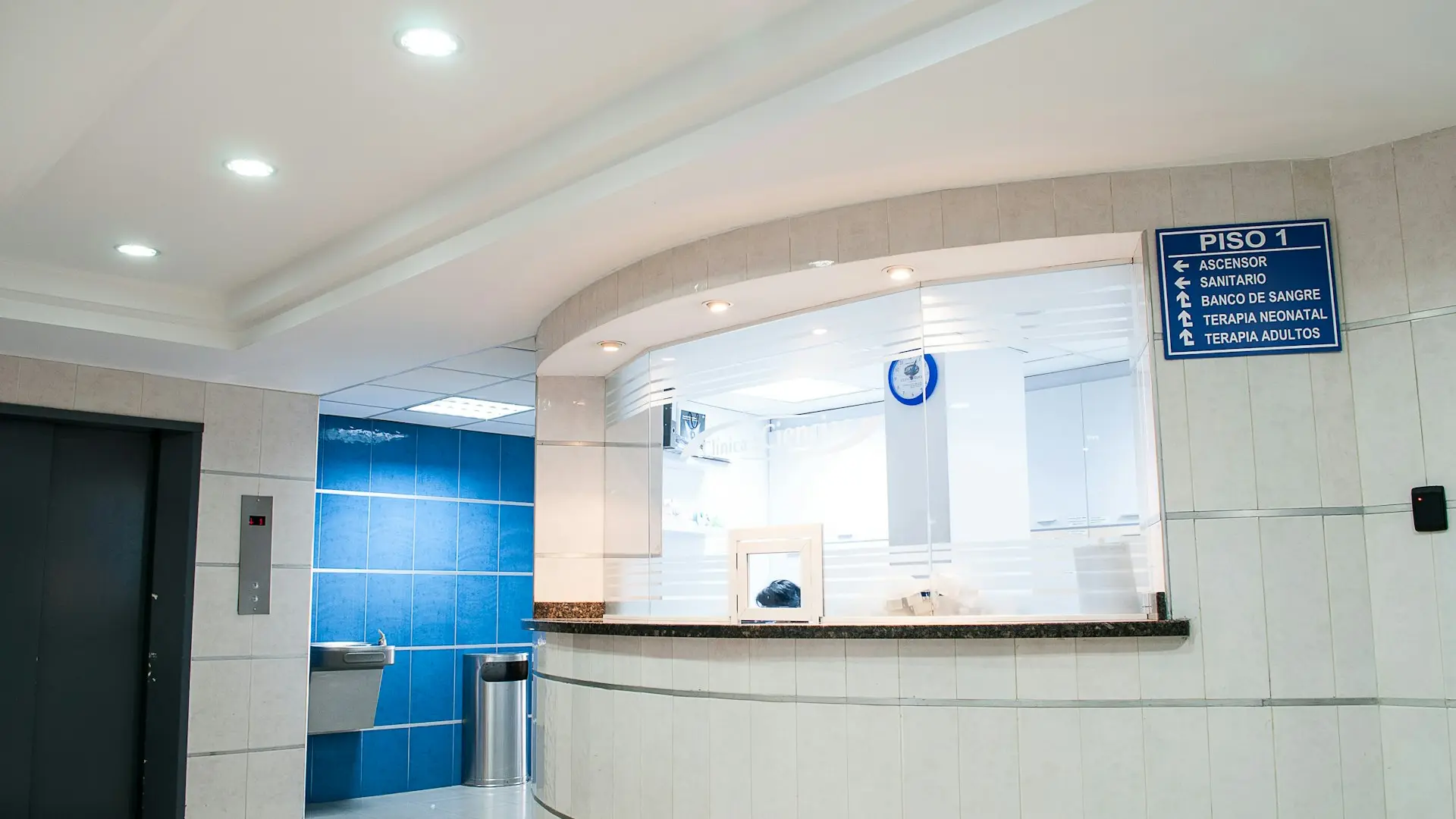 Hospital corridor representing laparoscopic surgical care in Thrissur